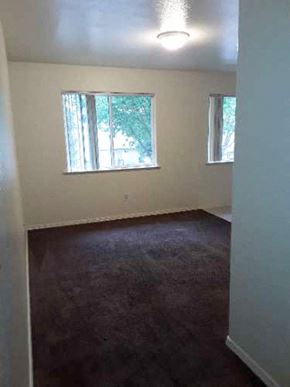 Planada apartment for rent - Image of carpeted room with two windows