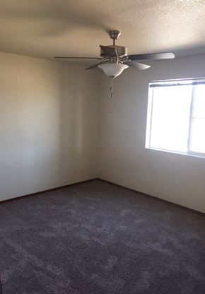 Polson apartment for rent - Image of carpet room  with fan and window