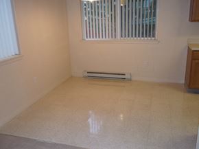 Polson apartment for rent - Image of space with two windows and heater next to kitchen