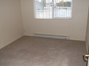 Polson apartment for rent - Image of room with window and baseboard heater