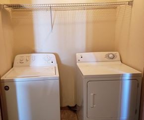Sheridan apartment for rent - Image of wash machine and dryer and rack above