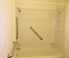 Libby apartment for rent - Image of bathtub with grab rales and towel rack