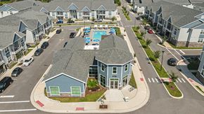 Gainesville apartment for rent - an aerial view of a neighborhood of houses with a swimming pool