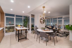 Los Angeles apartment for rent - A dining room with a table set for two and a view of the city.
