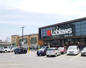 Ottawa apartment for rent - a colabans store with cars parked in a parking lot
