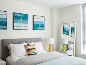Allston apartment for rent - a bedroom with a bed and pictures on the wall