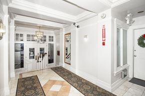 San Francisco apartment for rent - A hallway with a rug on the floor and a door on the right.