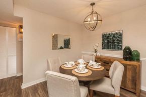 Madison apartment for rent - A dining room with a round table set for four.