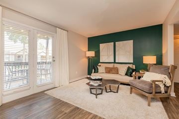 Madison apartment for rent - A living room with a couch, armchair, and a table with a lamp on it.