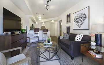 Salt Lake City apartment for rent - a living room with a couch and a glass table