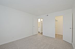 Mesa apartment for rent - the spacious living room of an apartment with carpeting and white walls