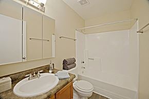 Phoenix apartment for rent - a bathroom with a sink and a shower and a toilet