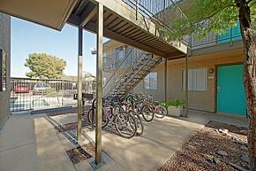 Phoenix apartment for rent - a row of bikes parked in front of a building