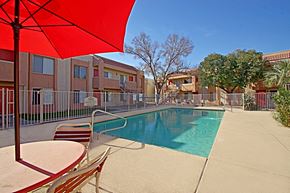 Avondale apartment for rent - our apartments have a swimming pool and a patio with chairs and an umbrella