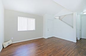 Mesa apartment for rent - an empty living room with hardwood floors and a window