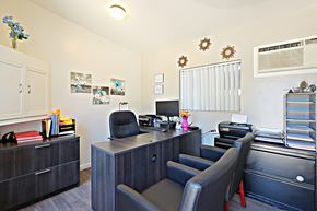 Tempe apartment for rent - a office with chairs and a desk with a computer