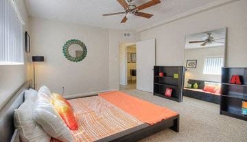 Phoenix apartment for rent - a bedroom with a bed and a ceiling fan