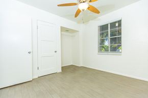 Phoenix apartment for rent - an empty room with a ceiling fan and a window