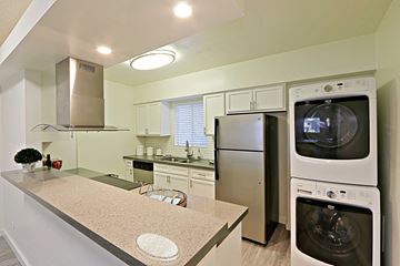 Phoenix apartment for rent - a kitchen with a washer and dryer and a sink
