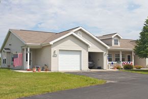 Fond Du Lac apartment for rent - a white house with an flag on the side of it