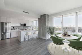 Boston apartment for rent - A modern kitchen with a dining table and chairs.