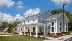 Landisville apartment for rent - a white house with a yard and a slide