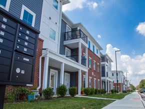 Landisville apartment for rent - a row of town homes with balconies and a sidewalk