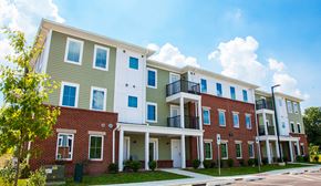 Landisville apartment for rent - a row of apartment buildings with red brick and green siding