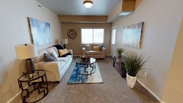 Fargo apartment for rent - a living room with a couch and a table