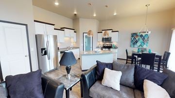 West Fargo townhouse for rent - a living room and kitchen with a couch and a table