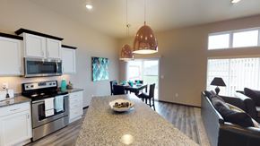 West Fargo townhouse for rent - copper light fixtures, kitchen isalnd