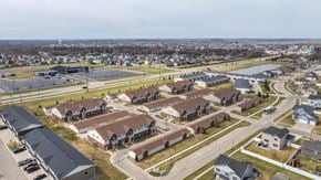 West Fargo apartment for rent - A suburban area with a mix of residential and commercial buildings.