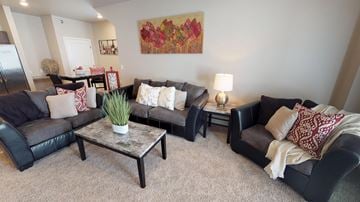 Moorhead apartment for rent - a living room with couches and a table