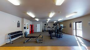 Moorhead apartment for rent - a gym with a lot of exercise equipment in it