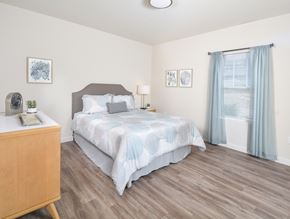 Cuyahoga Falls apartment for rent - a bedroom with a bed and a dresser and a window