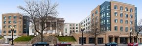 Washington apartment for rent - a city street with cars parked in front of buildings