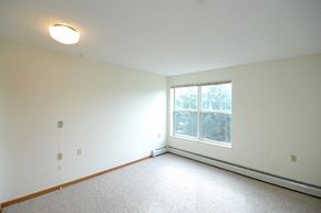 Minnetonka apartment for rent - a bedroom with a large window and white walls