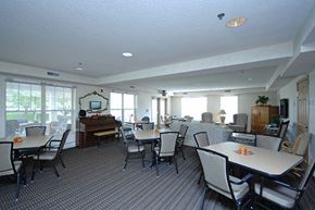 Minnetonka apartment for rent - a dining room with tables and chairs and a piano