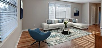 Seattle apartment for rent - A living room with a white couch and a blue chair.