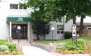 North York apartment for rent - The front of a building with a green awning and the number 30 on it.
