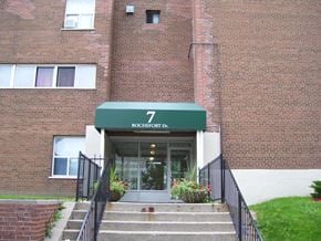 North York apartment for rent - A brick building with a green awning that says 7 Rochefort Dr.