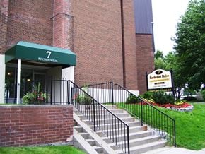 North York apartment for rent - A building with a green awning and a sign that says Bocheport.