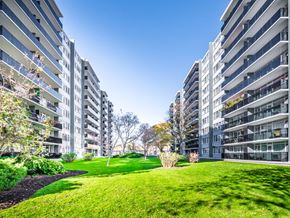 Toronto apartment for rent - A grassy area in front of two residential buildings.