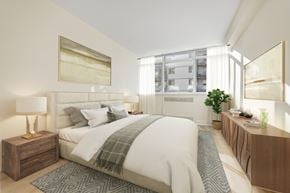 Etobicoke apartment for rent - A bedroom with a large bed and a wooden nightstand.