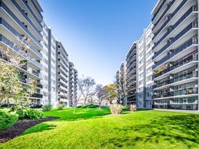 Etobicoke apartment for rent - A grassy area in front of two residential buildings.