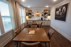 Augusta apartment for rent - a dining room with a table and chairs and a chess board