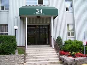North York apartment for rent - The front of a building with a green awning that says 34 St. Dennis Dr.