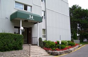 North York apartment for rent - A building with a green awning and the number 34 on it.