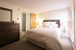Colchester apartment for rent - a bedroom with a bed and a dresser