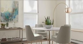 South Burlington apartment for rent - a dining room with a table and chairs and a lamp